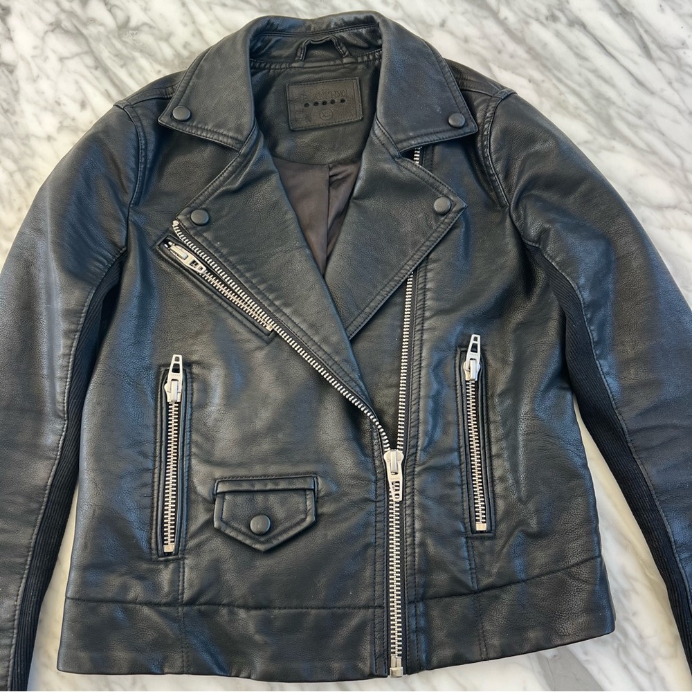 Beautiful faux leather moto jacket, with silver zipper details